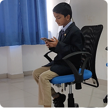 Student in school uniform using HydroAR on a smartphone during a classroom testing session